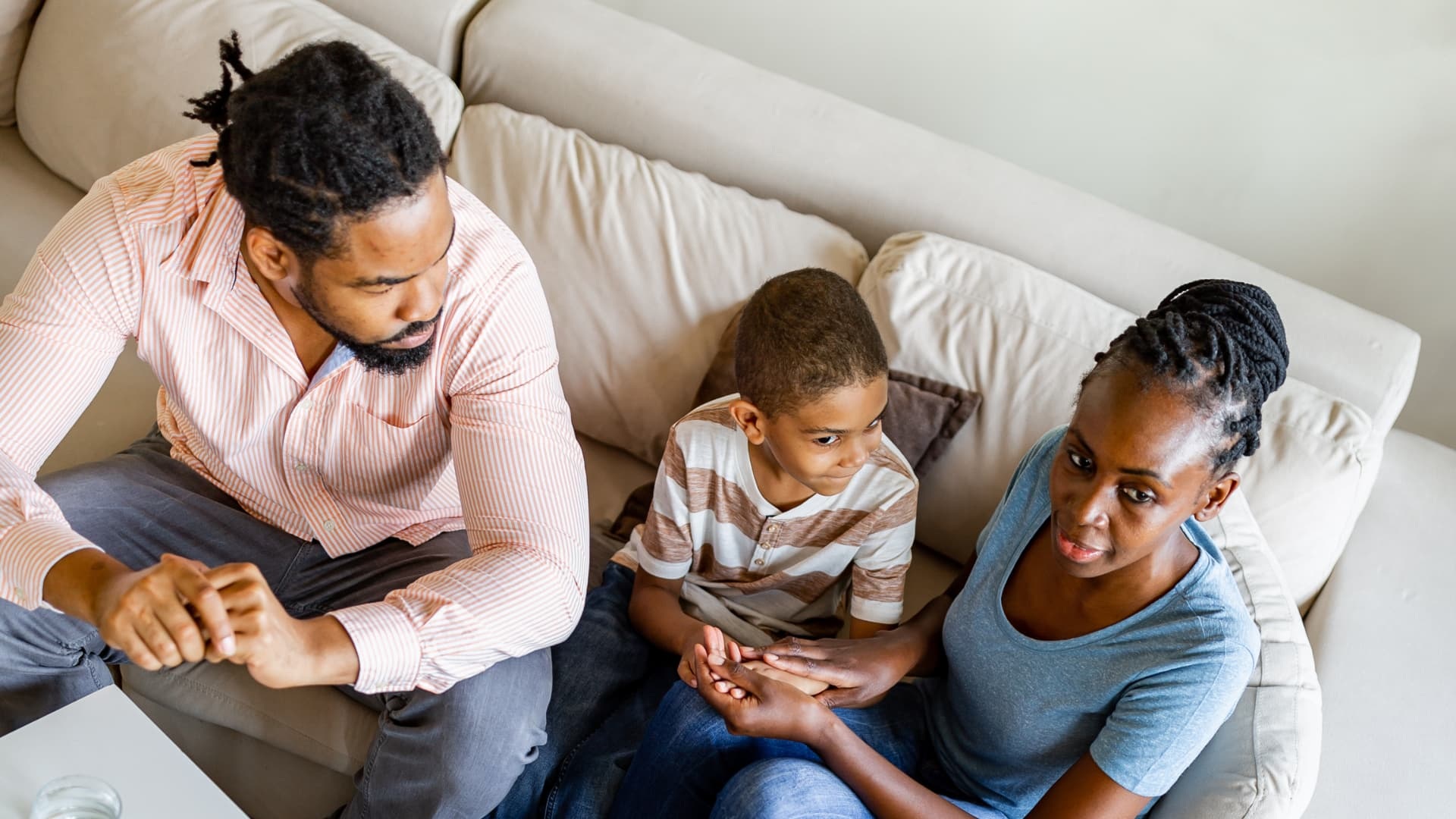 Child and parents in therapy session