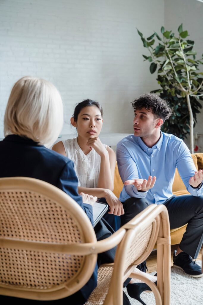 Couple in mediation in a therapist office talking to each other