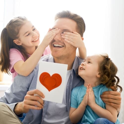 Dad with kids and a heart picture