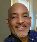 Man smiling, dressed in navy blue shirt - Tory High
